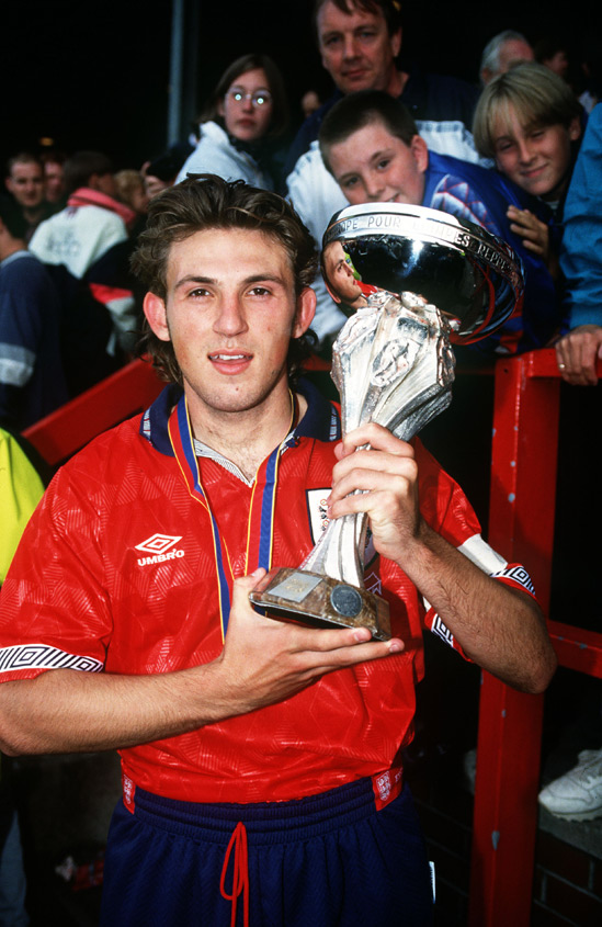 Darren Caskey poses alongside the UEFA European U18 Championship trophy in 1993.